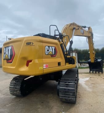 Escavatore 317 Caterpillar in azione